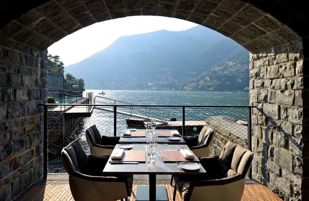 a table in a restaurant overlooking a lake
