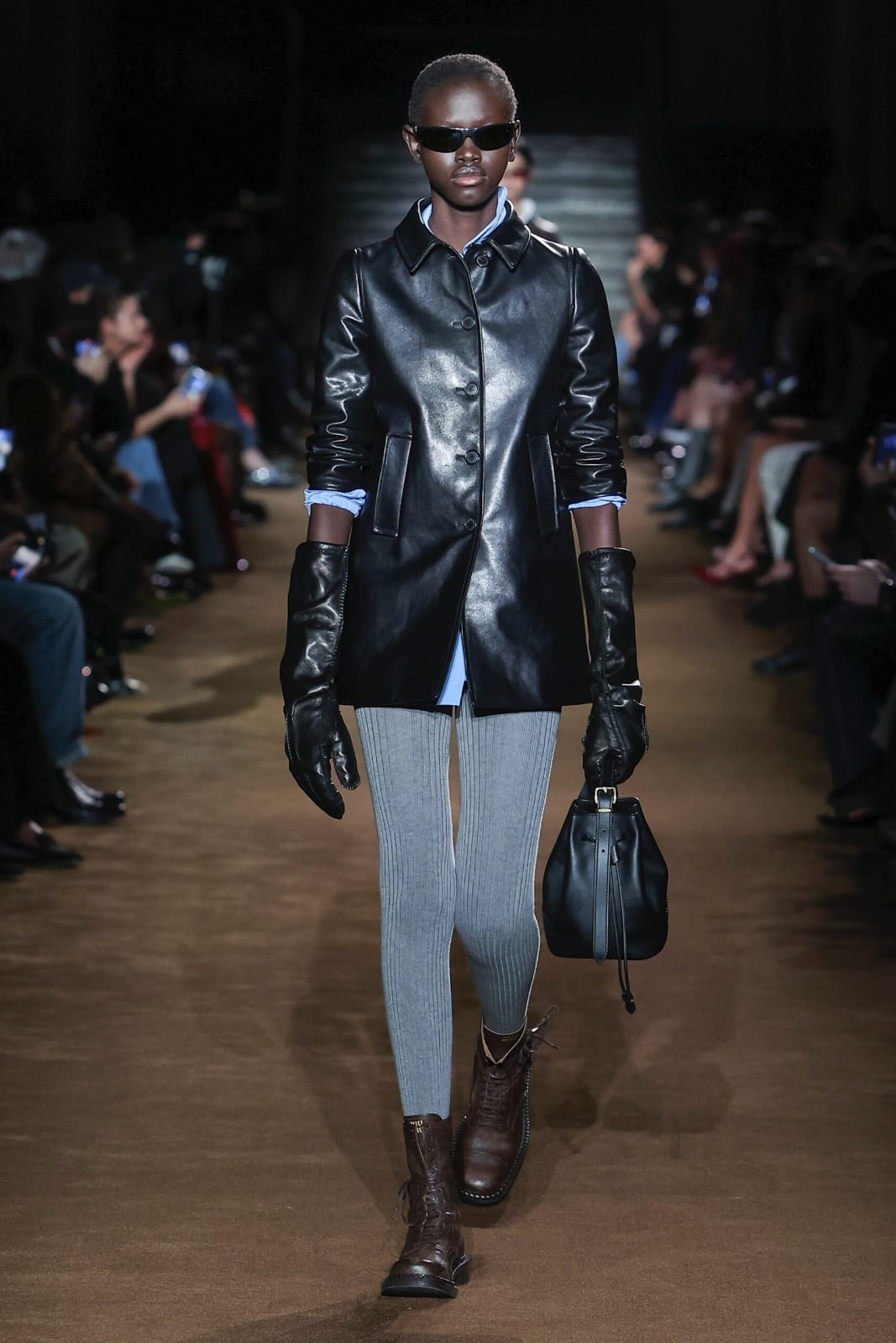 Miu Miu’s Fall/Winter 2024 show kicked off with a slew of refined double-breasted coats, pearl necklaces and oversized gloves