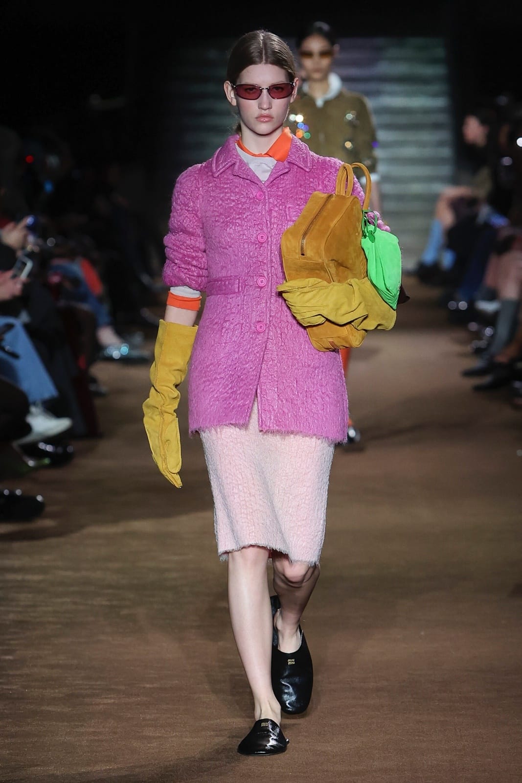 Miu Miu’s Fall/Winter 2024 show kicked off with a slew of refined double-breasted coats, pearl necklaces and oversized gloves